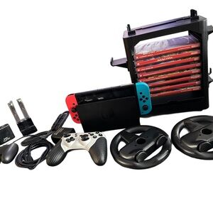 Nintendo Switch Console with Red and Blue Joy-Con and Accessories